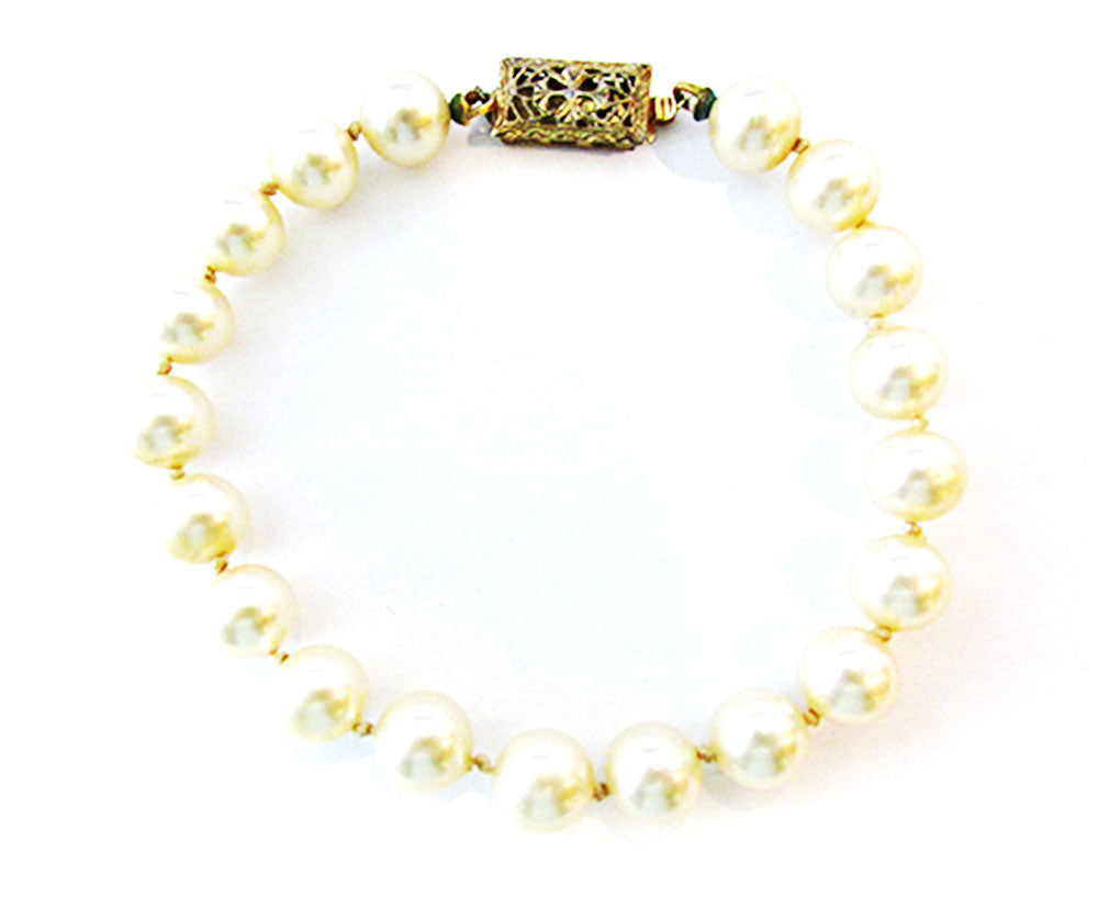 Vintage 1950s Jewelry Ivory Hand Knotted Pearl and Sterling Bracelet - Front